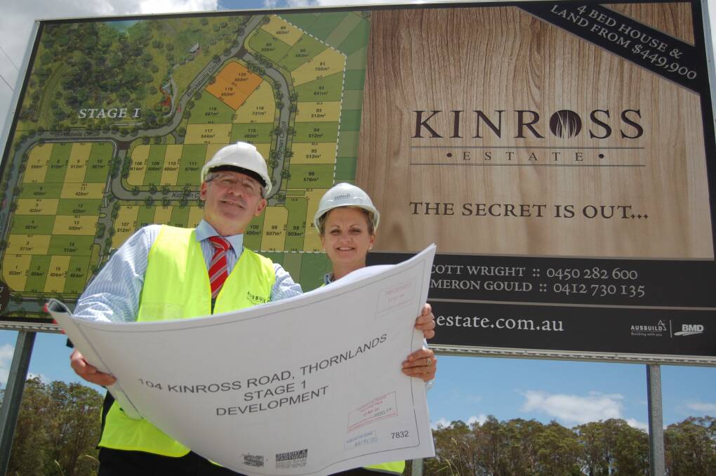 Ausbuild chief executive Ron Loney shows Redland Mayor Karen Williams plans for the first stage of his Kinross Estate development.  Photo: Kathryn Adams
