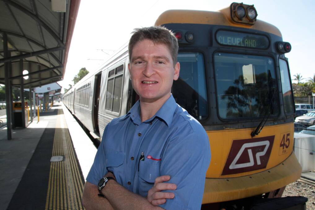 Queensland Rail train driver Ryan McConnell drove a train into Cleveland station on Wednesday, the 25th anniversary of the train line's re-opening.Photo by Chris McCormack