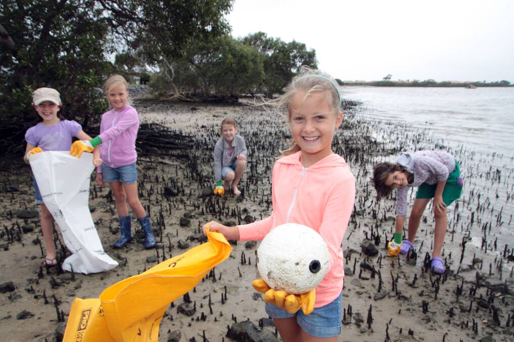 Aimee Kotynski, Hannah Peck, Brooke Archer, all aged 9, Krista Peck, 8, of Victoria Point and Asha Shirvington, 9 of Redland Bay clear rubbish from Thompsons Beach, Victoria Point, on Clean Up Australia Day. \n \nPhoto by Chris mcCormack