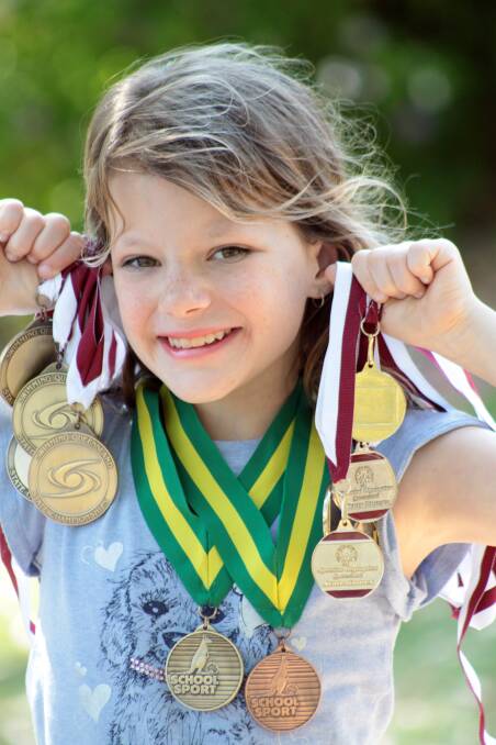 GOLDEN GIRL: Rylee Grier-Stralow, 10, won four gold medals at the School Sport Swimming Championships in Adelaide in September.  
Photo: Chris McCormack