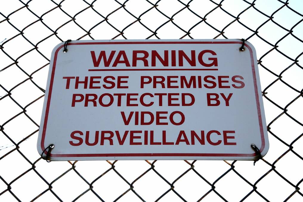 Protected by video surveillance sign