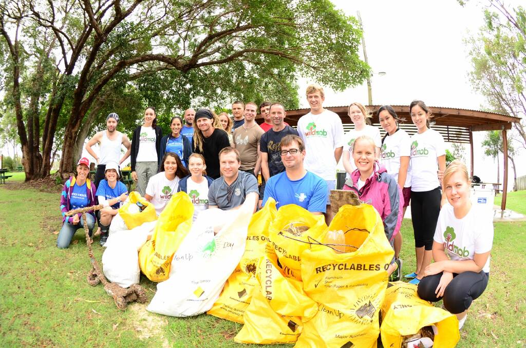 Reef Check Australia volunteers with the bags of rubbish they picked up during their Clean Up Australia campaign on North Stradbroke Island.