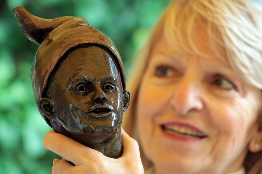 JULY: Artist Georgette Schwantes of Birkdale with her gnome sculpture of Campbell Newman. Photo by Chris McCormack