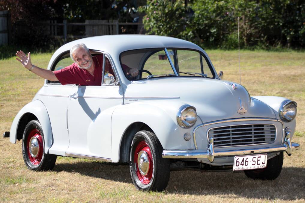 OCTOBER: Garry Stanton from the Brisbane Southside Morris Minor Car Club admires his 1955 Morris Minor. Photo by Chris McCormack