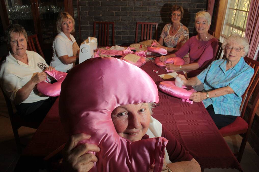 OCTOBER: Redland Zonta members' Margaret Finegan (front) with from left at back - Jo Hieatt of Carina, Debbie Clancy of Manly, Barbara Carter of Birkdale, Jan Forge of Manly and Phyllis Pledger of Wynnum make cusions for breast cancer patients. Photo by Chris McCormack