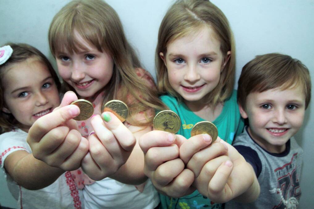 OCTOBER: l-r- Lucy Montgomery, 6, Emily Herbert, 9, Emma Montgomery, 8 and  Luke Herbert, 6, all of Wellington Point get ready for the One Dollar Day. Photo by Chris McCormack