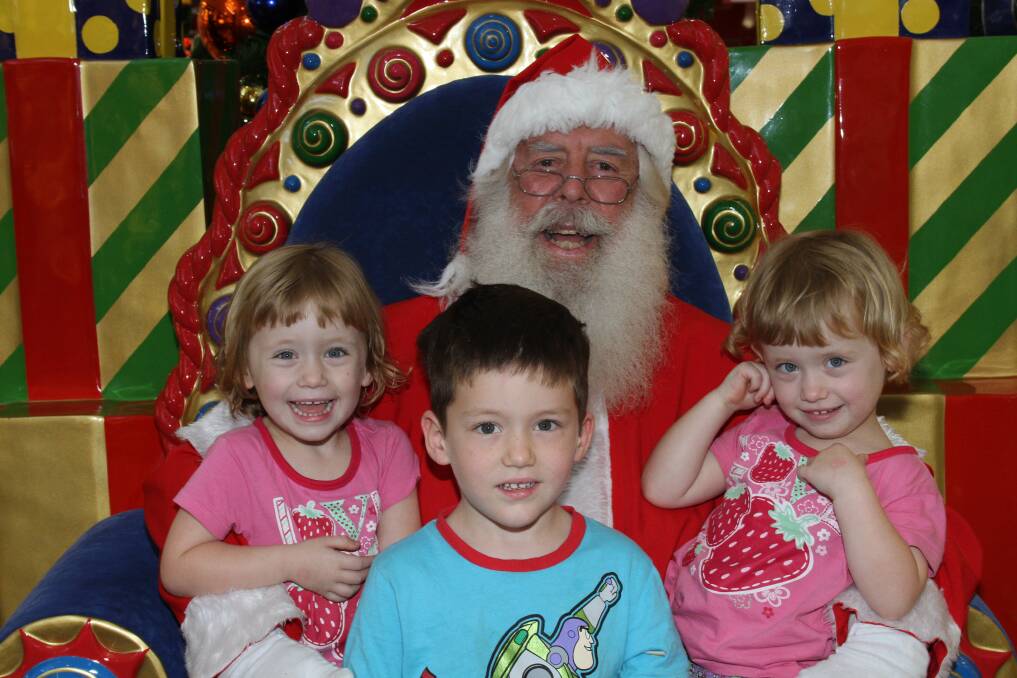 NOVEMBER: Santa at Victoria Point Shopping centre - Chloe, 2, Oscar, 4 and Sophie Cole, 2 of Alexandra Hills. Photo by Chris McCormack