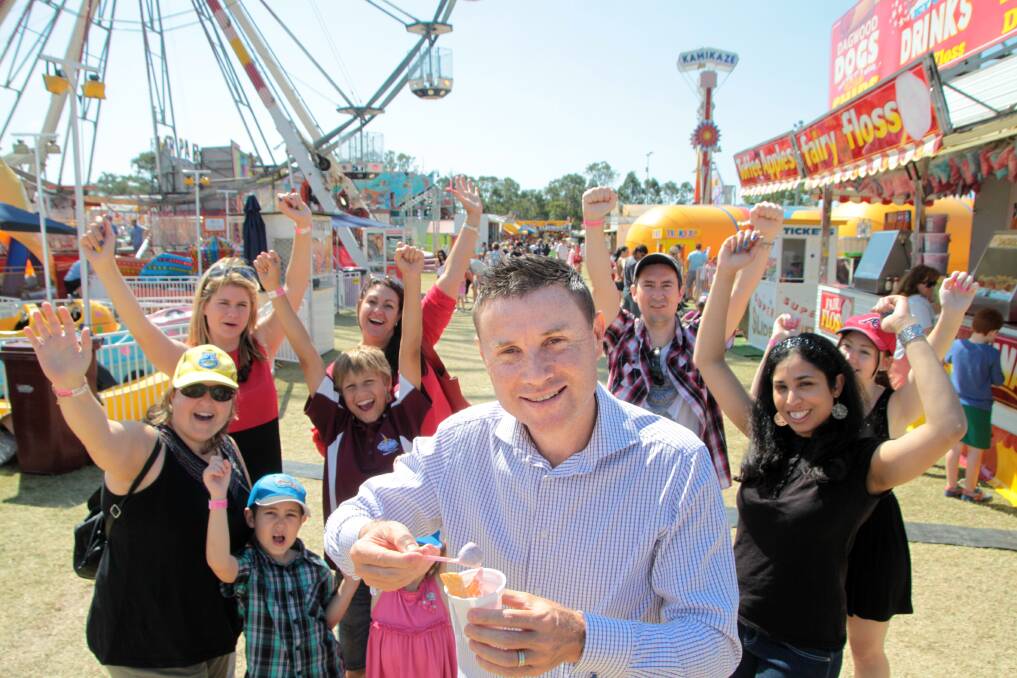 SEPTEMBER: Federal election: Bowman MP Andrew Laming celebrates his win at Redfest with a strawberry icecream. Photo by Chris McCormack