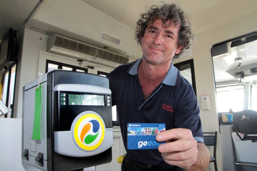 JUNE: New ticketing machines have just been installed in the Bay Island Ferries. Bay Islands Transit System deckhand Mark Peacock with the new machine. Photo by Chris McCormack