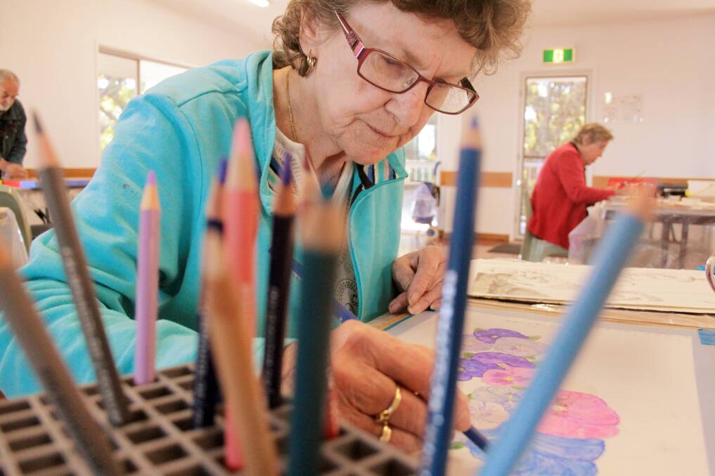 JUNE: Patricia Screen of Coochiemudlo Island works on her drawing ' Pansies'. Photo by Chris McCormack