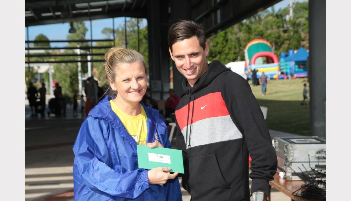 Jarred Corby gets his prize from mayor Karen Williams. 