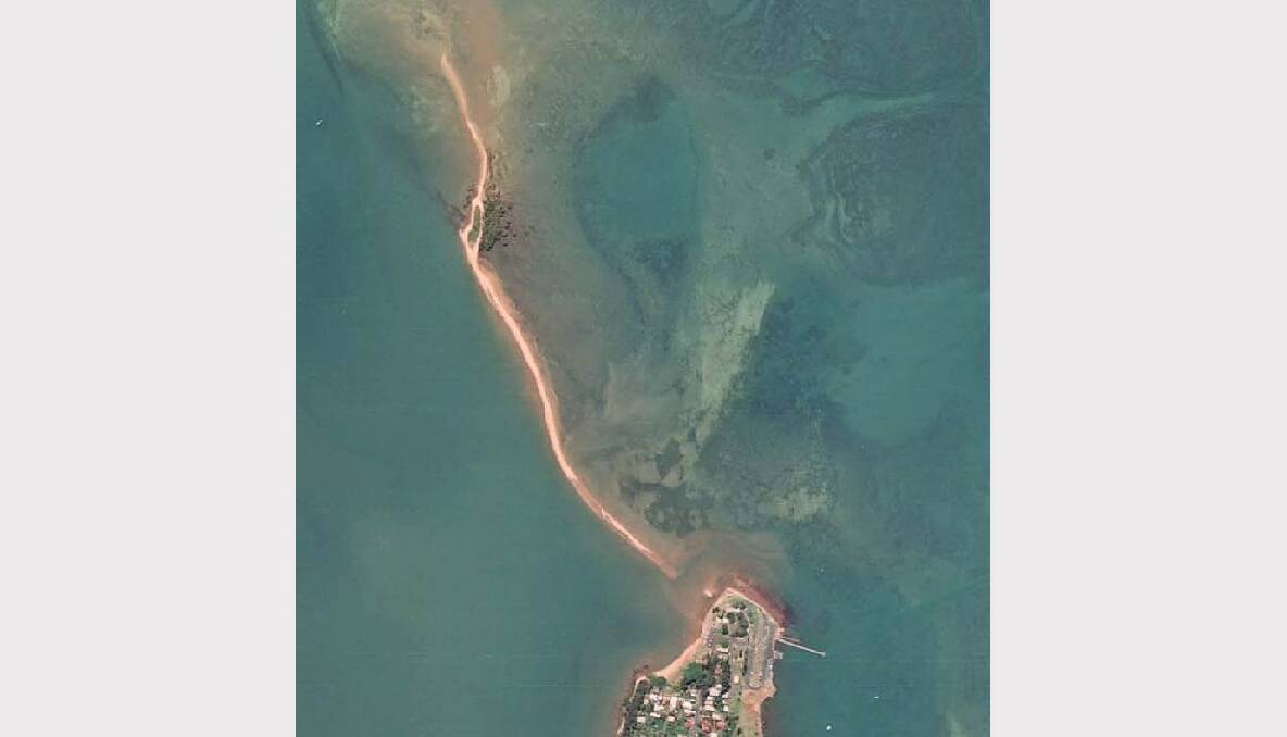 This 1998 aerial photograph of King Island, which is in the top left-hand side of the photo, shows hardly any vegetation on the island's western beach.