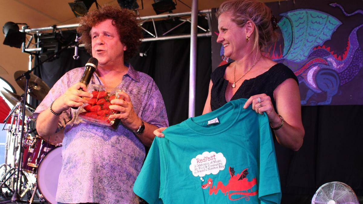 Mayor Karen Williams presented Leo Sayer with Redland strawberries and a RedFest t-shirt
