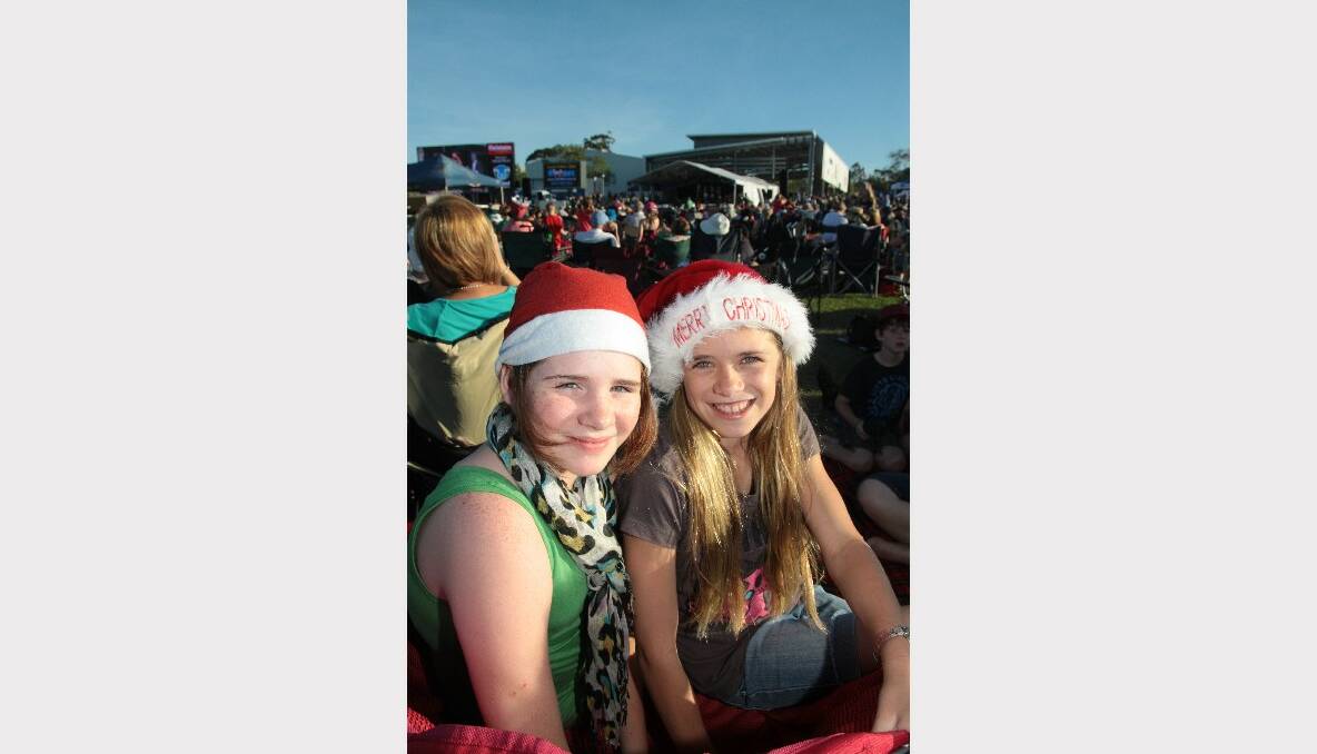 Skye Trenerry and Tayla Hodges, both 11 of Birkdale enjoying the Christmas by Starlight concert at Norm Price Park, Cleveland Showgrounds.