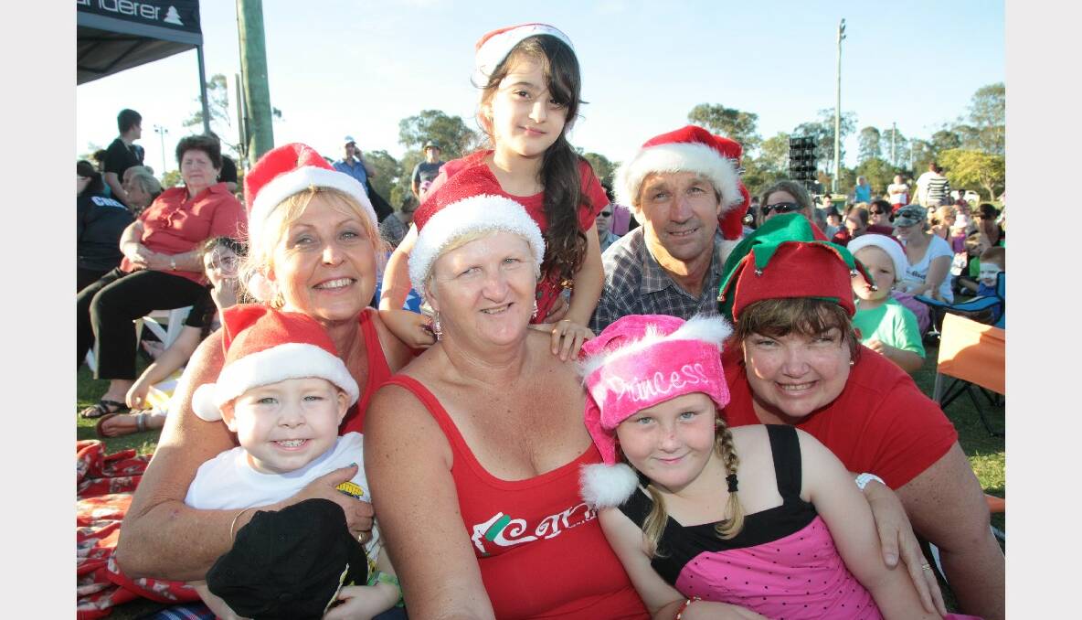 Oliver Wildermuth, 3, of Cleveland, Deeanne Wildermuth of Capalaba, Karen Byth of Birkdale, Anastasia Byth, 7, of Wakerley, Shane Robinson of Birkdale, Layla Ridgeway, 10 of Wynnum North, Tricia Dietz, Birkdale enjoying the Christmas by Starlight concert at Norm Price Park, Cleveland Showgrounds.