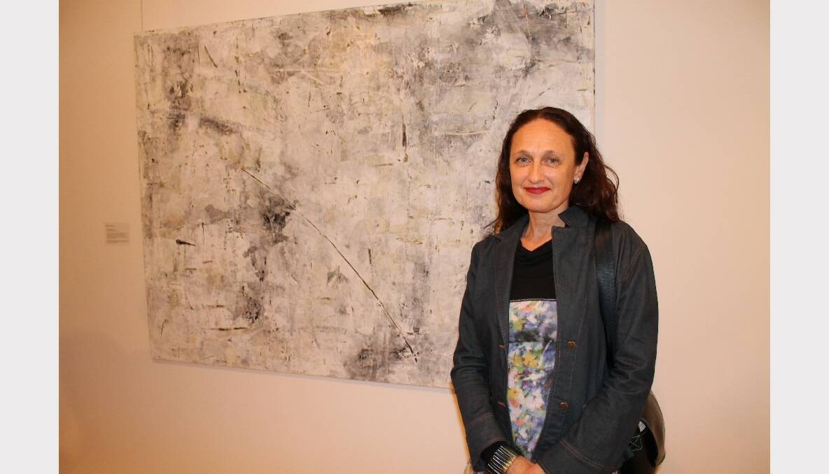Claudine Marzik with her award winning painting - Limestone Walls