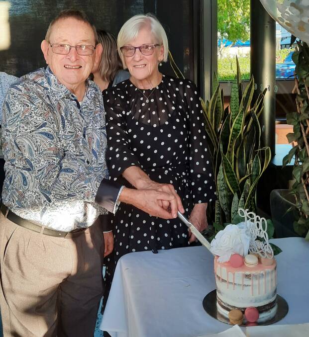 ANNIVERSARY: Peter and Pauline Walker cut into their 60th wedding anniversary cake at Elysium Restaurant Bar Victoria Point
