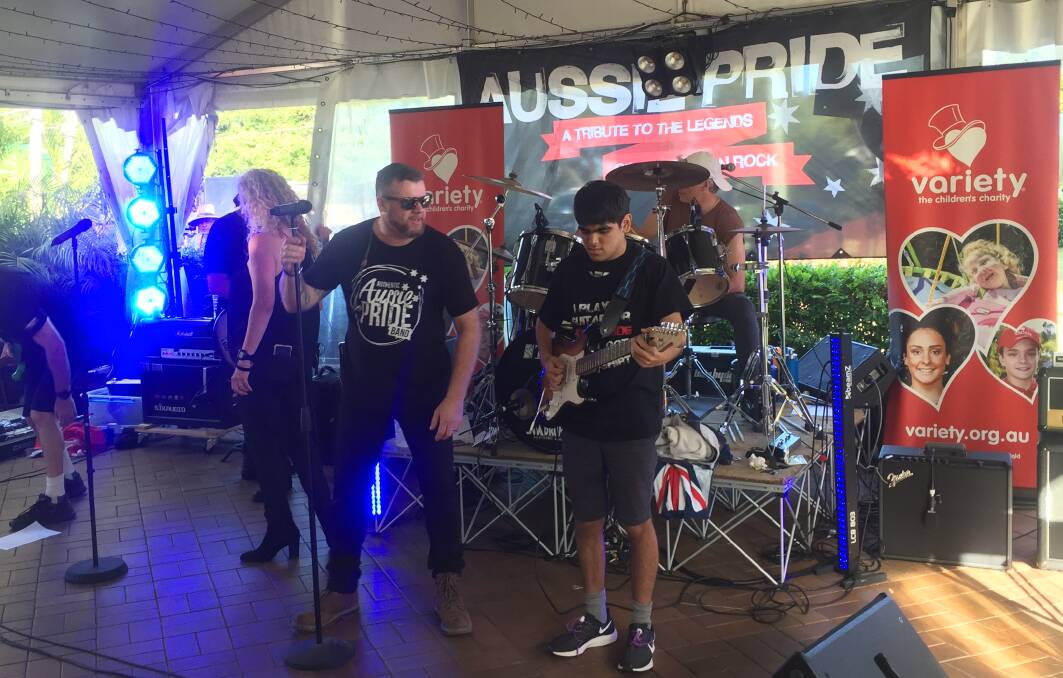 ROCKSTAR: William Martinelli rocks out on stage with local band Aussie Pride to raise funds for Variety.