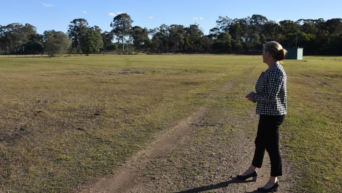 Cr Williams stands at the open grassed space where the proposed Redland Whitewater Centre could be built. Photo by Emily Lowe.