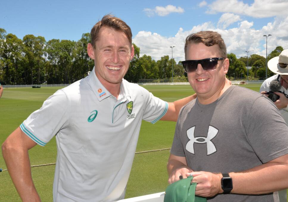 ALL SMILES: Redland cricketer Marnus Labuschagne with cricket fan Justin of Alexandra Hills. Photo: Emily Lowe.