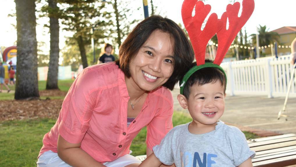 JOLLY: Shirreen Lee and Aidan Po, 2, of Ormiston at last year's Christmas on the Coast celebrations at Raby Bay Harbour.