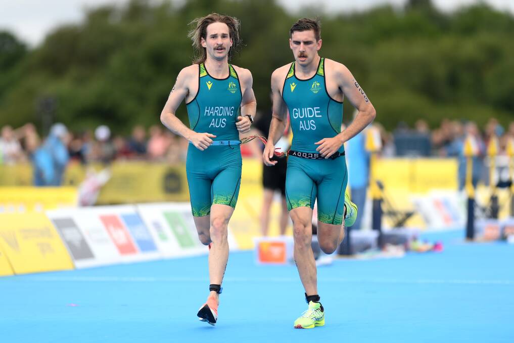 Sam Harding and his guide Harvey Luke of Team Australia in action on way to winning silver in the Mens Para Triathlon PTVI on day three of the Birmingham 2022 Commonwealth Games. (Photo by David Ramos/Getty Images)
