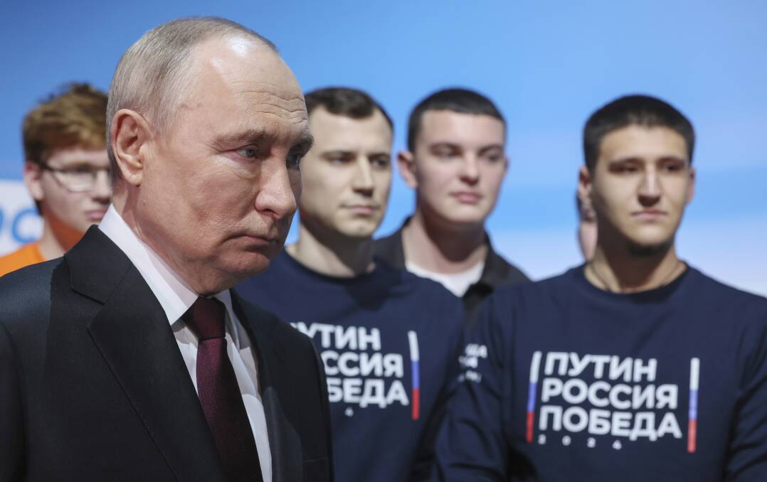 Russian President Vladimir Putin visits his campaign headquarters after a presidential election in Moscow, Russia, Sunday, March 17, 2024. (Mikhail Metzel, Sputnik, Kremlin Pool Photo via AP)