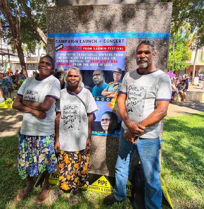 FRACKING: Traditional Owners from the Beetaloo Basin Gillian Limmen, Naomi Wilfred and Johnny Wilson gathered in Darwin to voice opposition to Santos and Darwin Festival. Photo: Supplied.