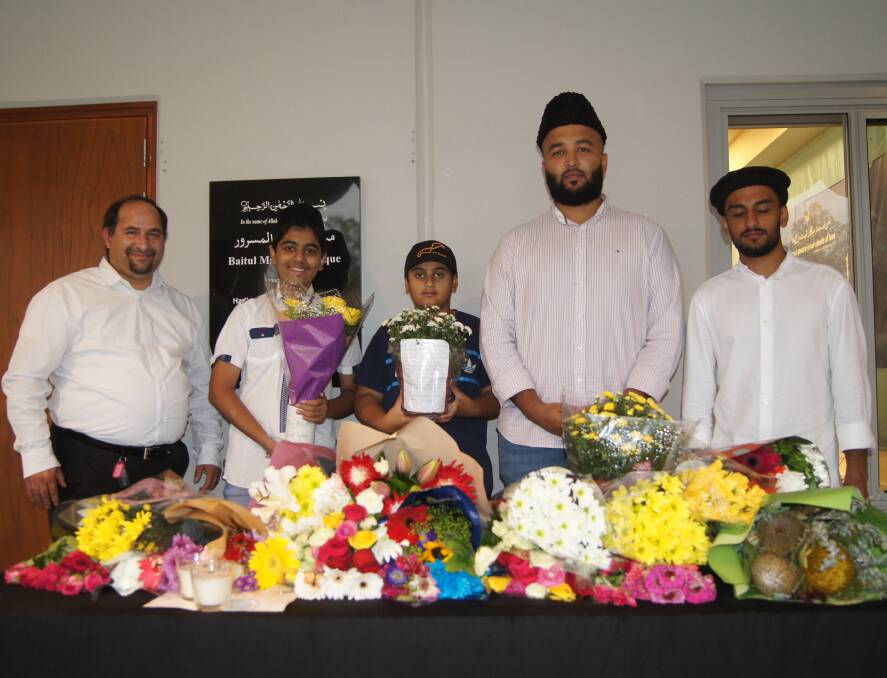 SOLIDARITY: Members of the Ahmadiyya Muslim community at the Stockleigh Baitul Masroor Mosque held a vigil ceremony on Sunday. Photo: Jacob Wilson