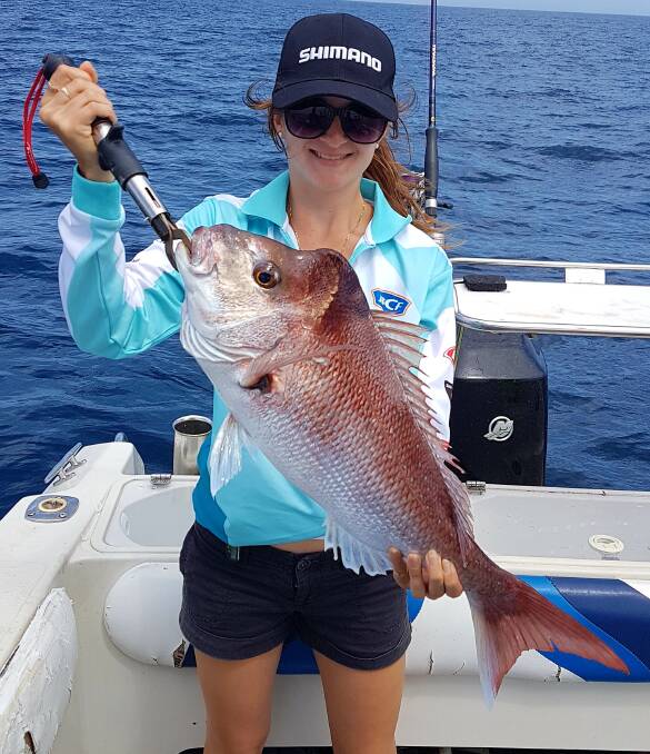 SNAPPING THEM UP: Nicola Fletcher shows off the good sized snapper caught off the Gold Coast.