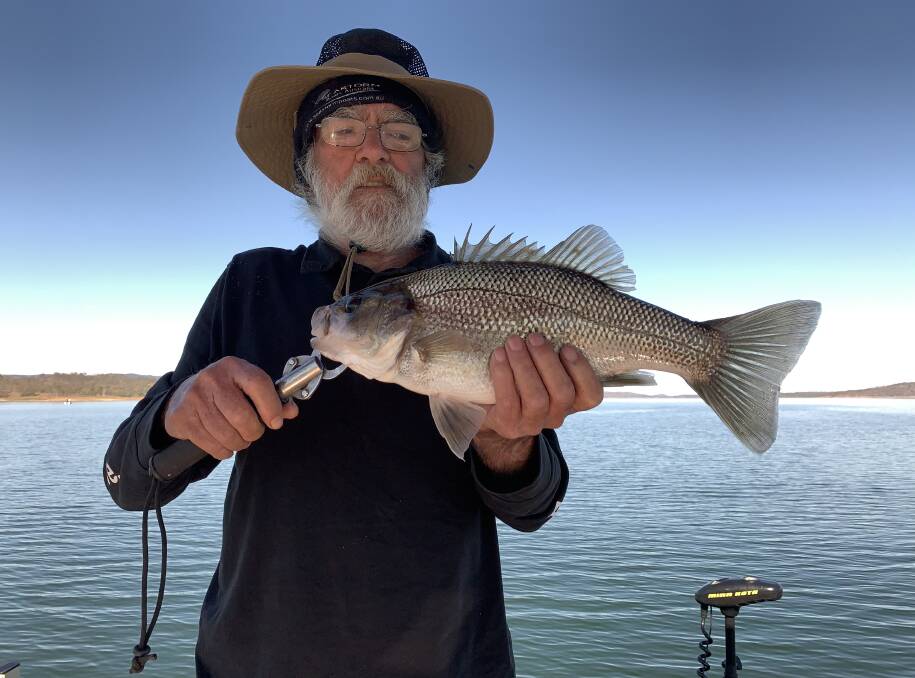 PLENTY ABOUT: Ron Meddings with a winter bass caught on Lake Wivenhoe.