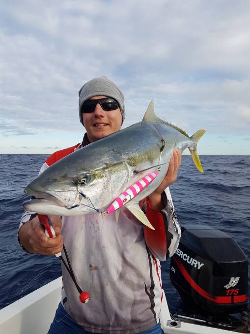 ANGLING ROYALTY: Jordan Greenfield with a magnificent kingfish caught deep jigging offshore.
