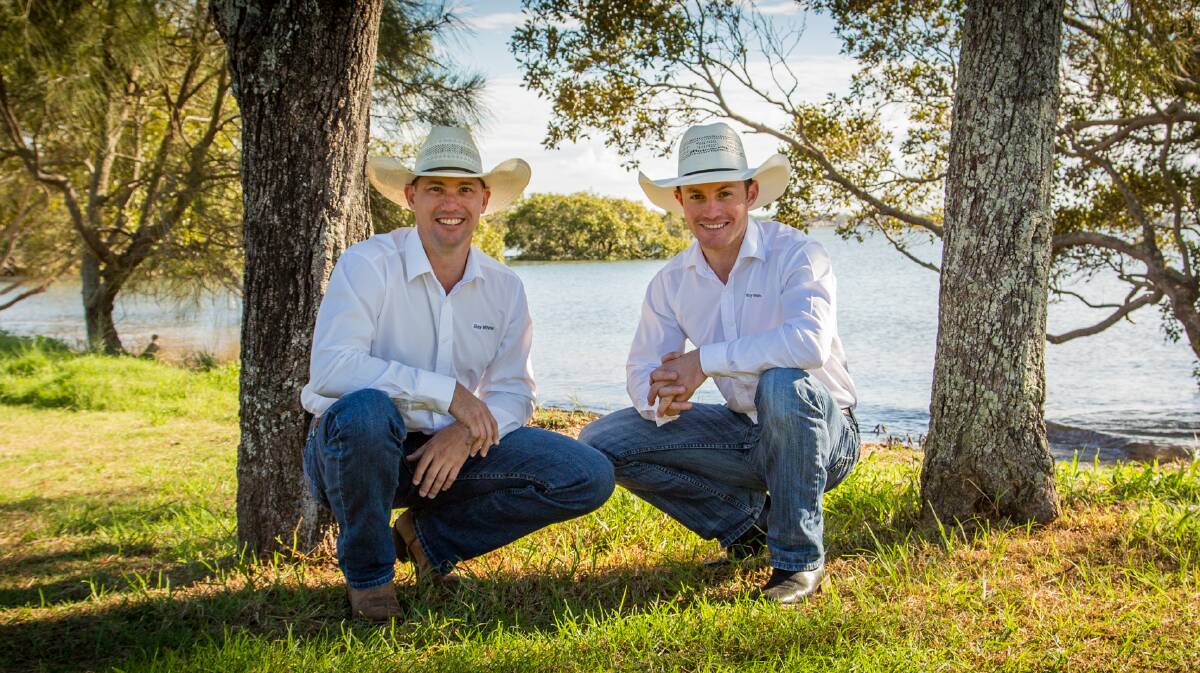 KICKER: Ray White Redland Bay real estate agent Jesse James and Jesse van Nek hope to see you at Grass Roots Bull Riding 2018. Photo: VidPicPro.com 