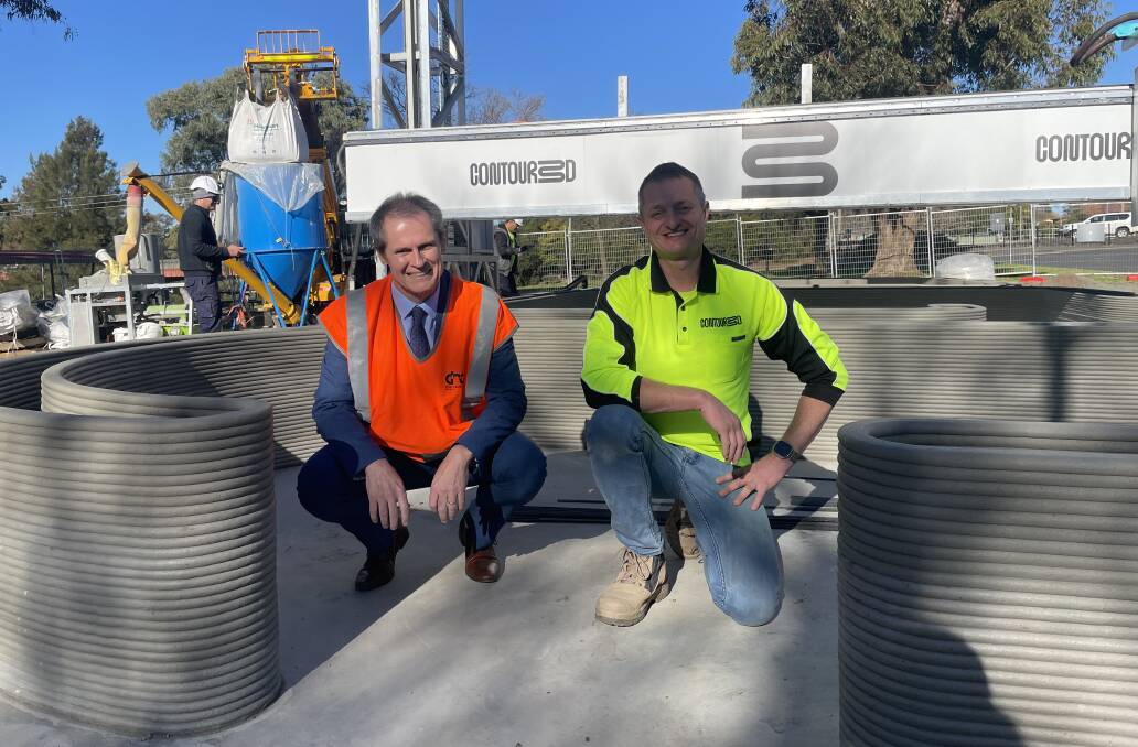 Dubbo Mayor Mathew Dickerson and Contour3D CEO Nick Holden kneel inside the 3D printed walls of the new amenities at Lions Park. Picture by Ciara Bastow 