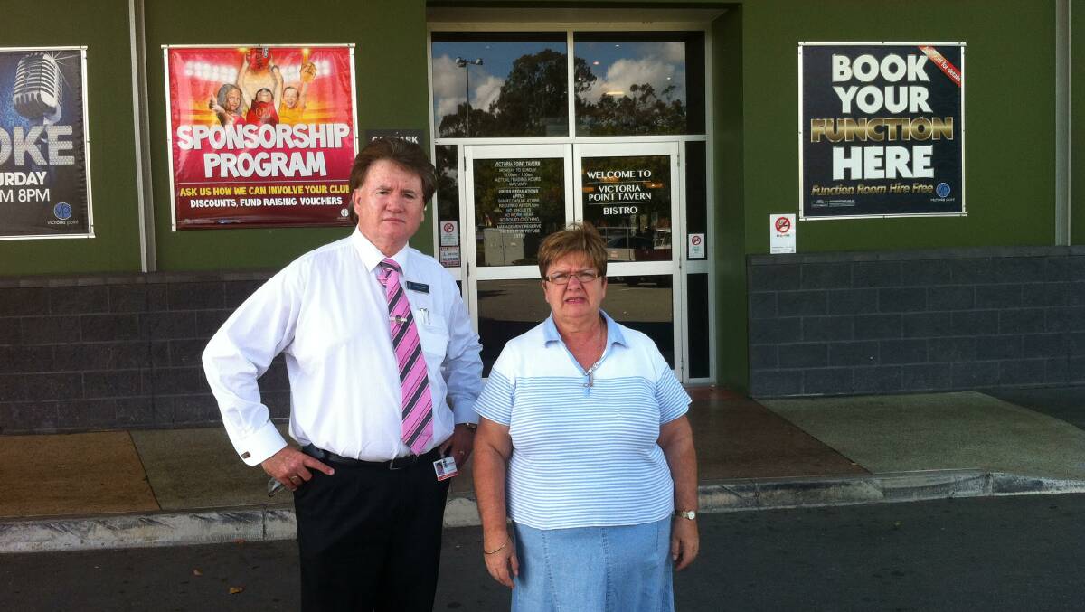 Redland councillor Lance Hewlett and resident Maria Sealy outside the Victoria Point Tavern, held up by axe-wielding thugs.