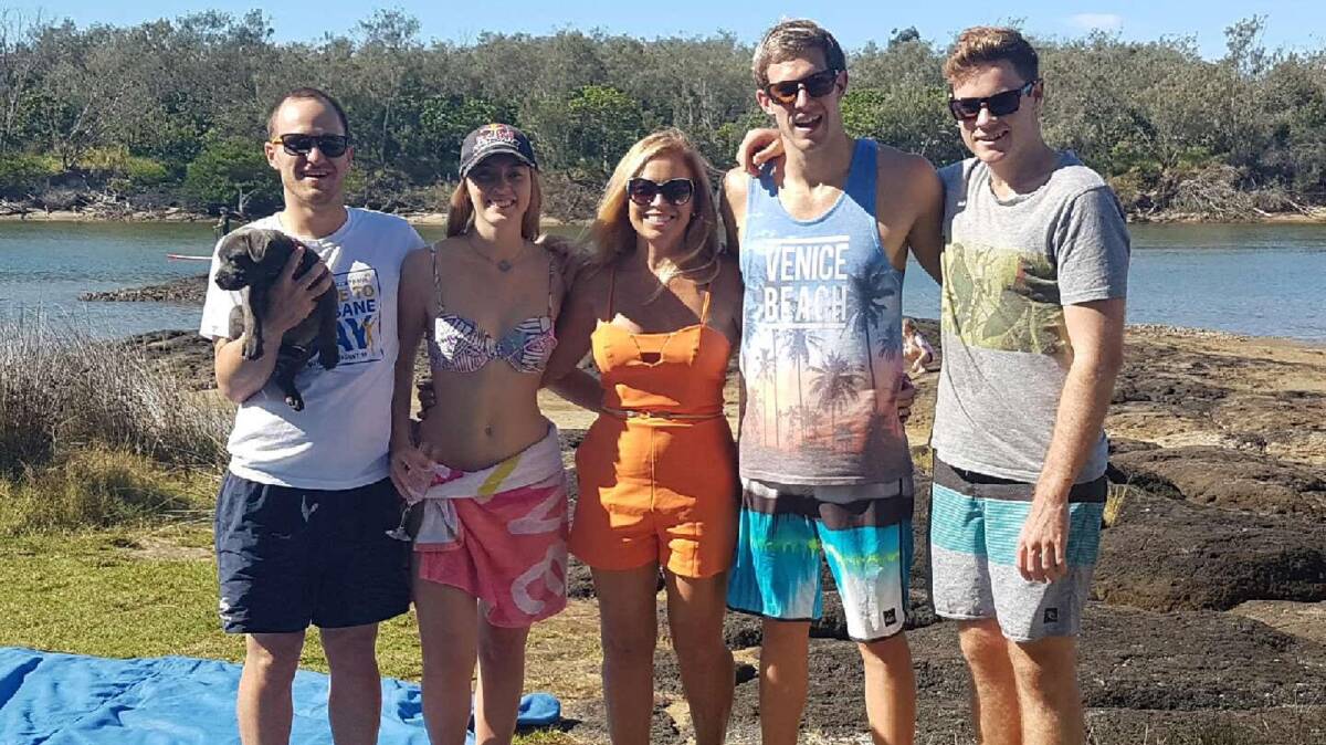 Paralympian swimmer Daniel Fox, second from right, with his mum Julie, centre, on Mother's Day last week. Fox has scored a spot on the Australia Paralympic squad.