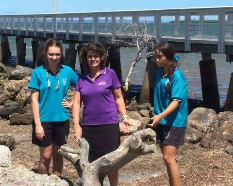 Cr Wendy Boglary with Wellington Point State High School students Lucy Laurie and 
Sara Annakin inspecting one of the dead trees on the Wellington Point foreshore.