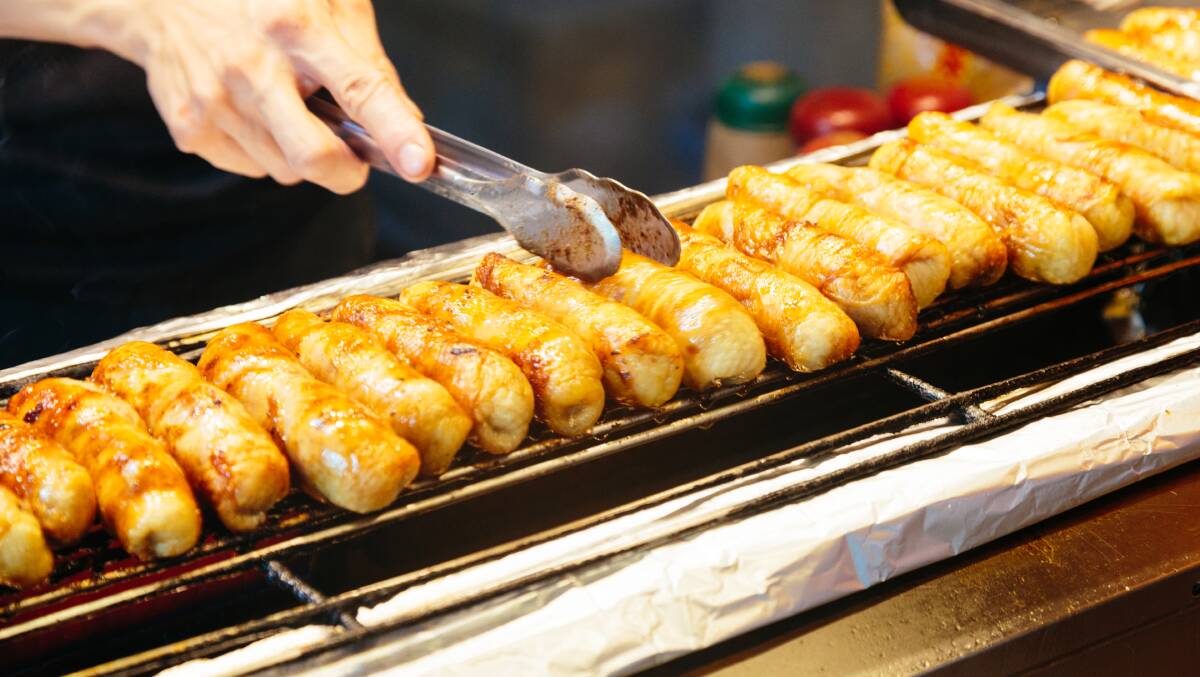 Enjoy the delicious juices of a traditional sausage at Kaohsiung's night market.