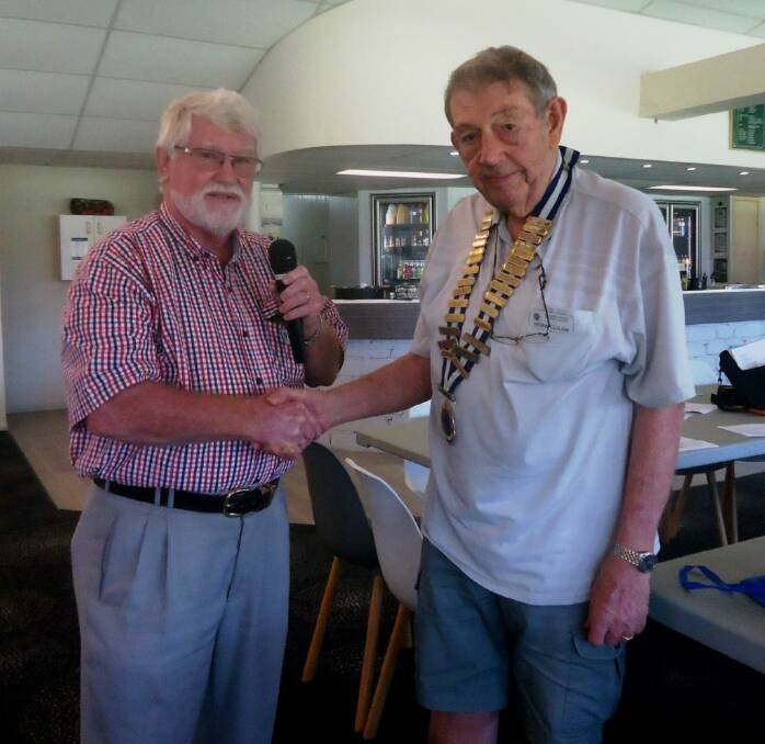 NEW LEADERSHIP: Phillip Horton hands over the presidency to Bevan Clulow.