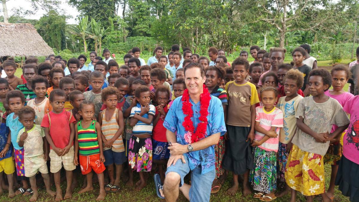 VANUATU: Neale Collier with students from the Mwast Primary School.