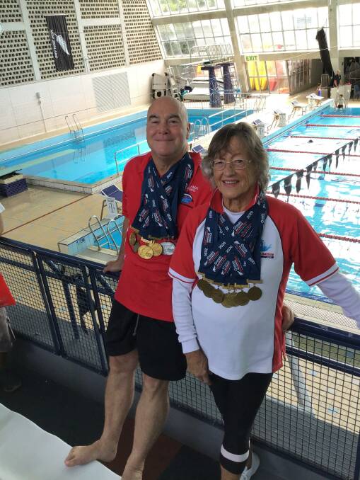 MEDAL WINNERS: Redlands Bayside Masters Swimming Club coach Trevor Green with swimmer Dot Simmons at the New Zealand Masters Games in February. 