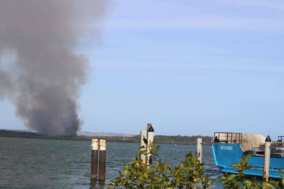 FIRE RISK: Plumes of smoke coming from a Macleay Island blaze in 2016.