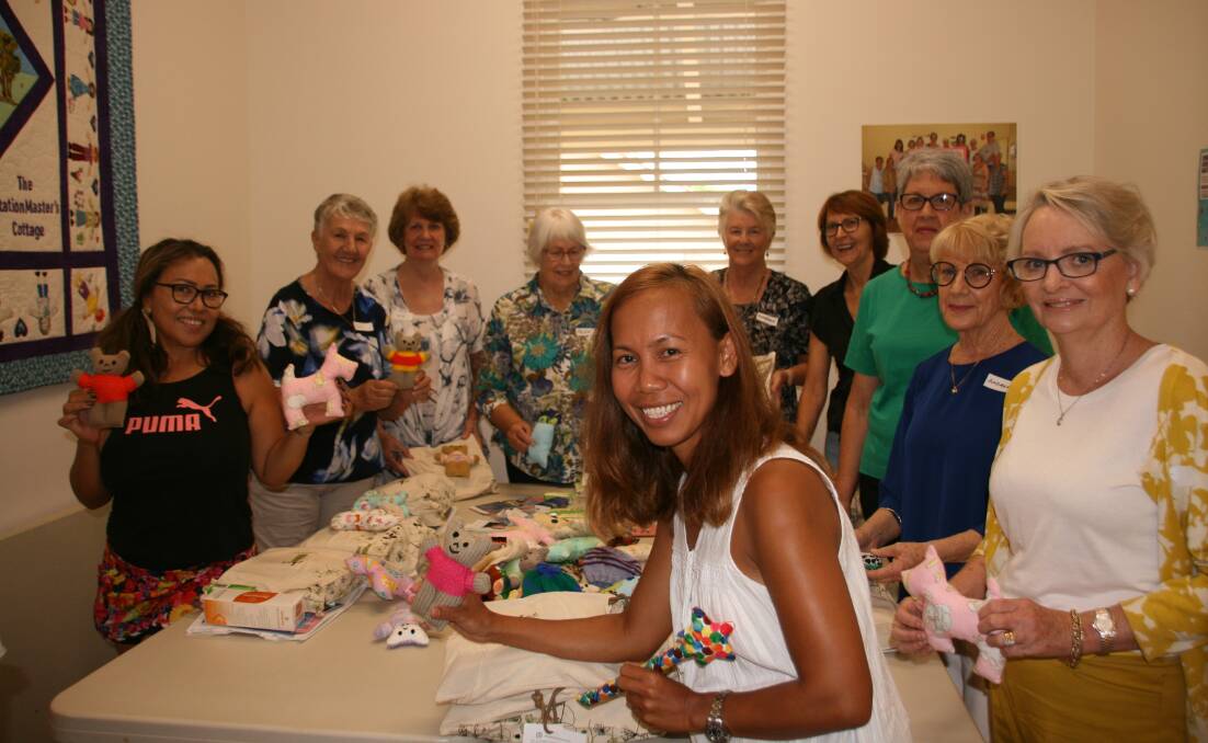 CELEBRATION: Redlands Centre for Women volunteers putting together care packages for babies born at Redland Hospital. The centre will host a cocktail party for International Women's Day.