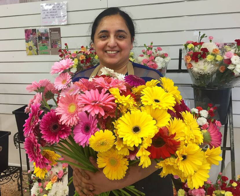 GIVING BACK: Sharon Sihota from BIrkdale Flower Farm said surplus flowers were given out to community members, including at aged care homes and schools.