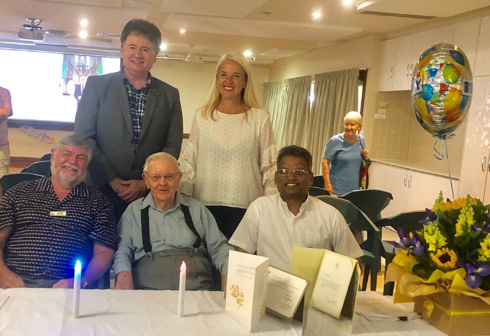 BIRTHDAY: Salford Waters Residents Committee president Trevor Browne, Terry Latchford and Fr Joseph Vattaparambil of St Ritas Parish (front) with deputy mayor Lance Hewlett and Redlands MP Kim Richards.
