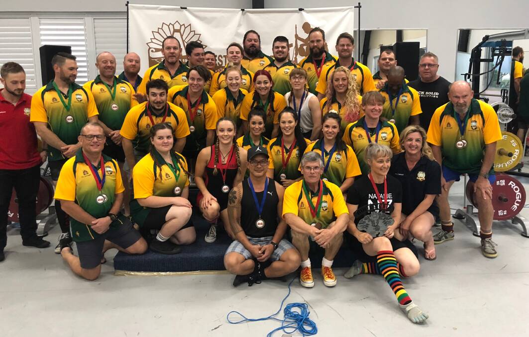 WINNERS: The Australian powerlifting team at the Anzac International, including Kevin Rogers (centre front), Peter Church (far right) and Simon Knechtli (second row, far left).