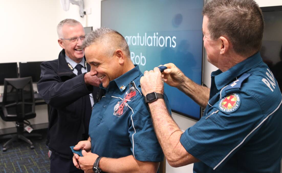 NEXT STEP: Robert Rattray receives his new epaulettes after completing his Certificate IV in Health Care. 