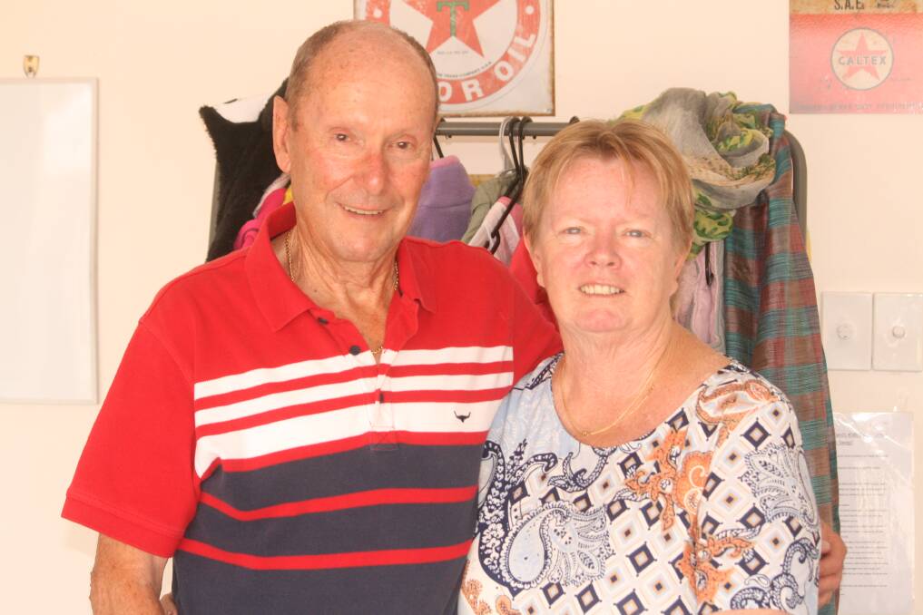 GIVING BACK: Brian and Narelle Jeffriess say they love to see the smiles on children's faces as they try on clothes.