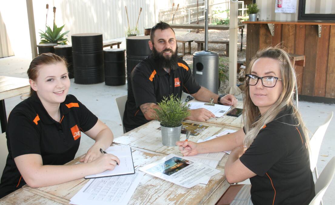BUSINESS QUALIFIED: Jamie Dixon, program co-ordinator Paul Bowers and Angie Bowers. Photo: Stacey Whitlock