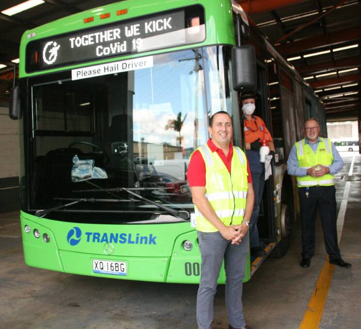 KICKING COVID: Capalaba MP Don Brown with Transdev cleaner Laurena and head of business operations Mark McKenzie.